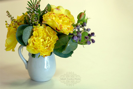 spray rose miniature arrangement in a jug