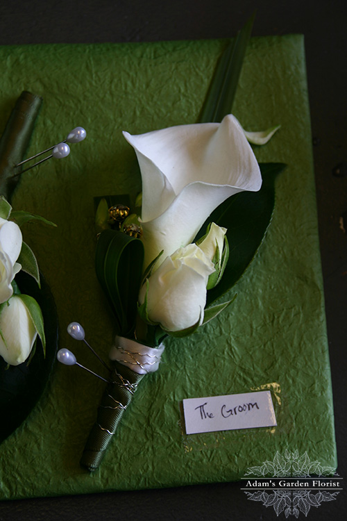 calla buttonhole for the groom