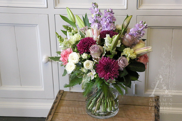 seasonal cut flowers in glass vase