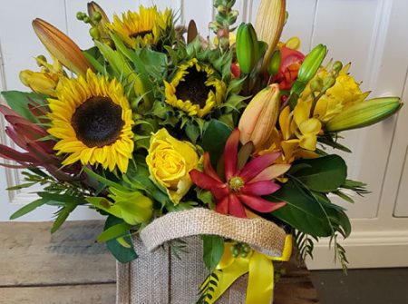 Jute bag florals. Yellow, orange, red. From Gold Coast Flower Shop Parkwood.